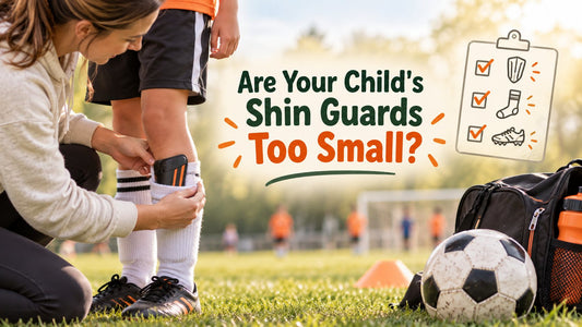 Parent checking whether a child's soccer shin guard provides enough coverage.